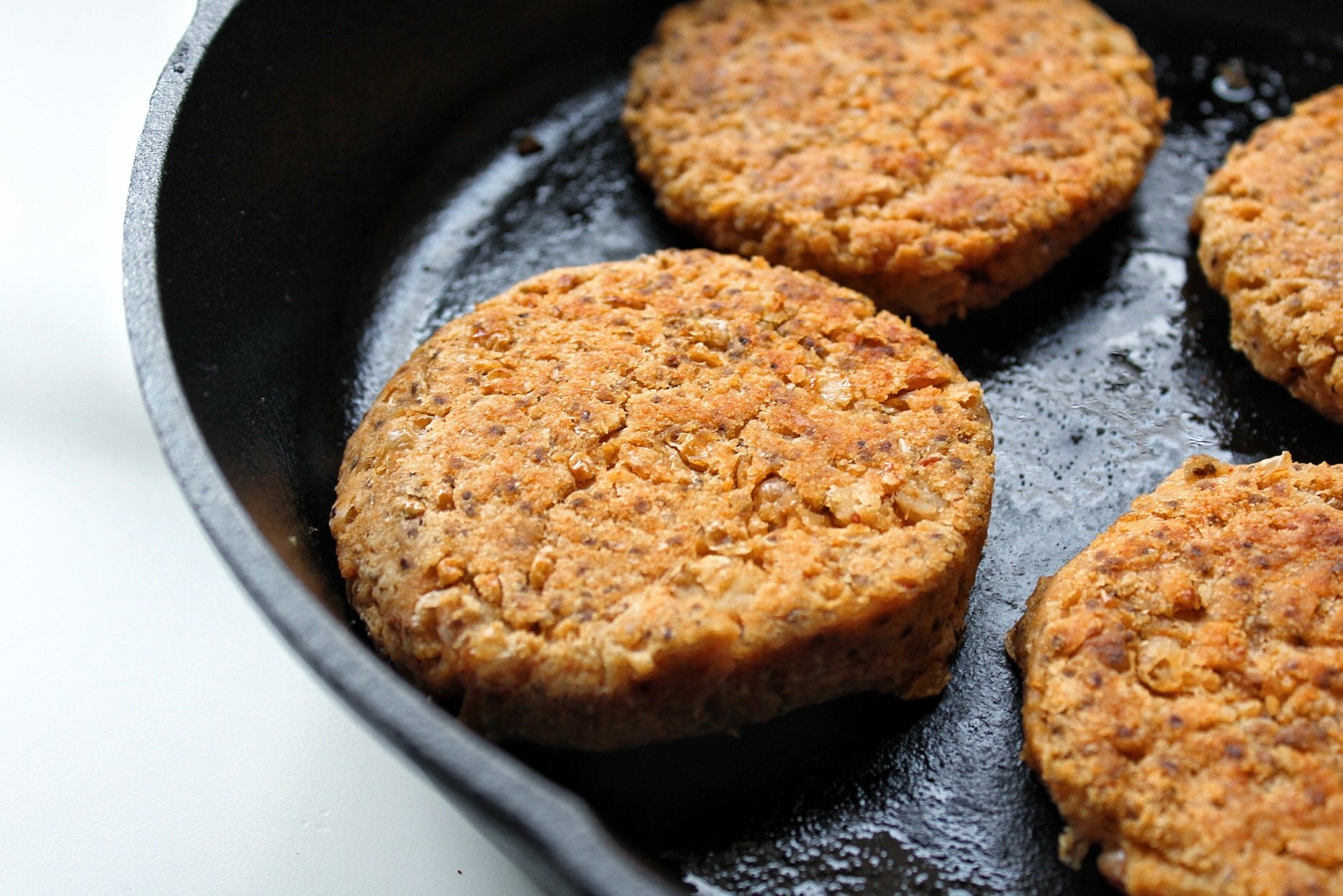 Cannellini bean veggie burger in cast-iron skillet