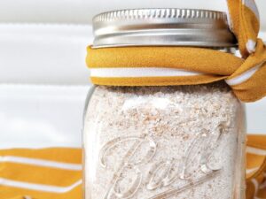 Oat flour in a glass mason jar.
