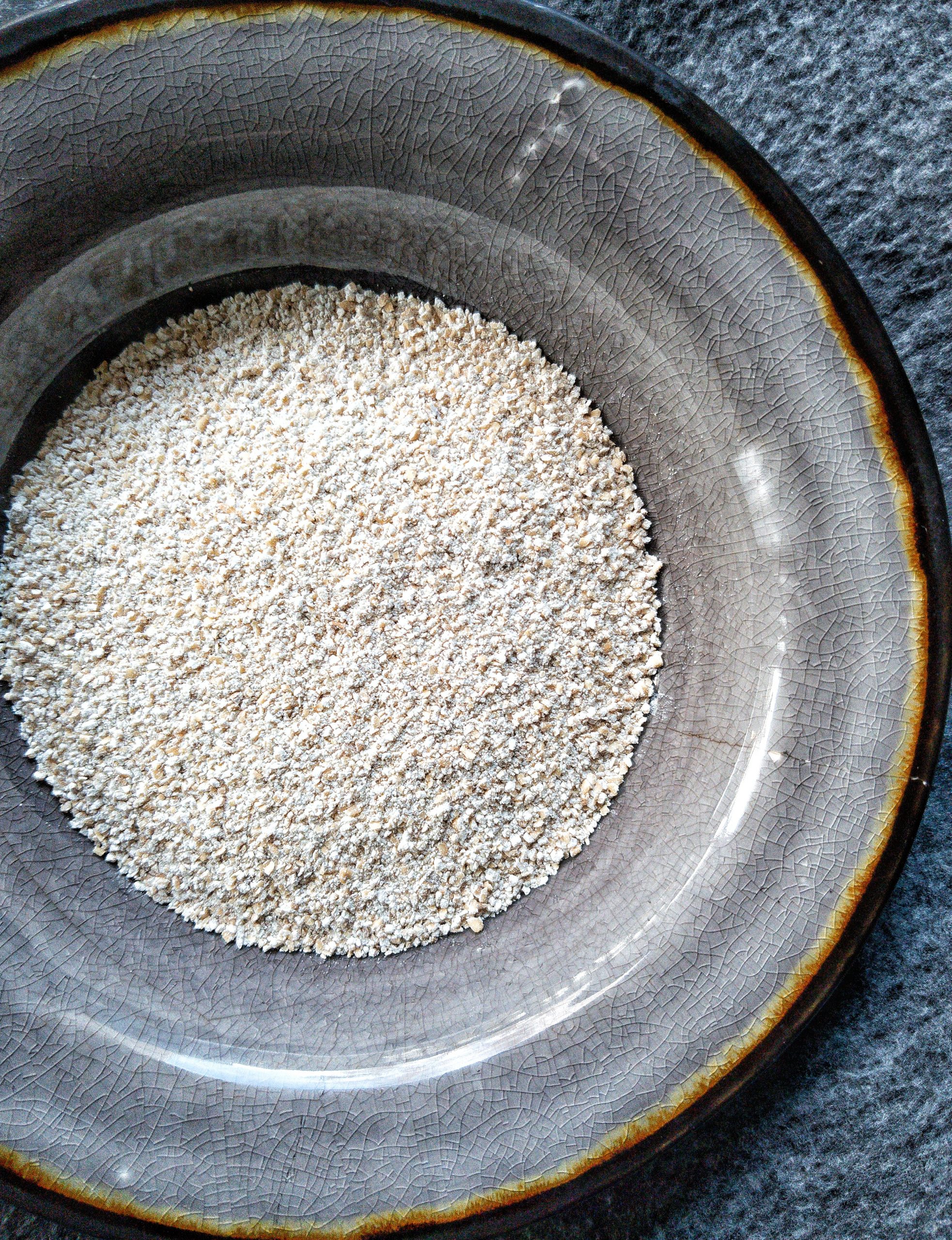 Gray bowl with oat bran flour