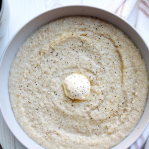 Creamy oat bran topped black pepper and vegan butter