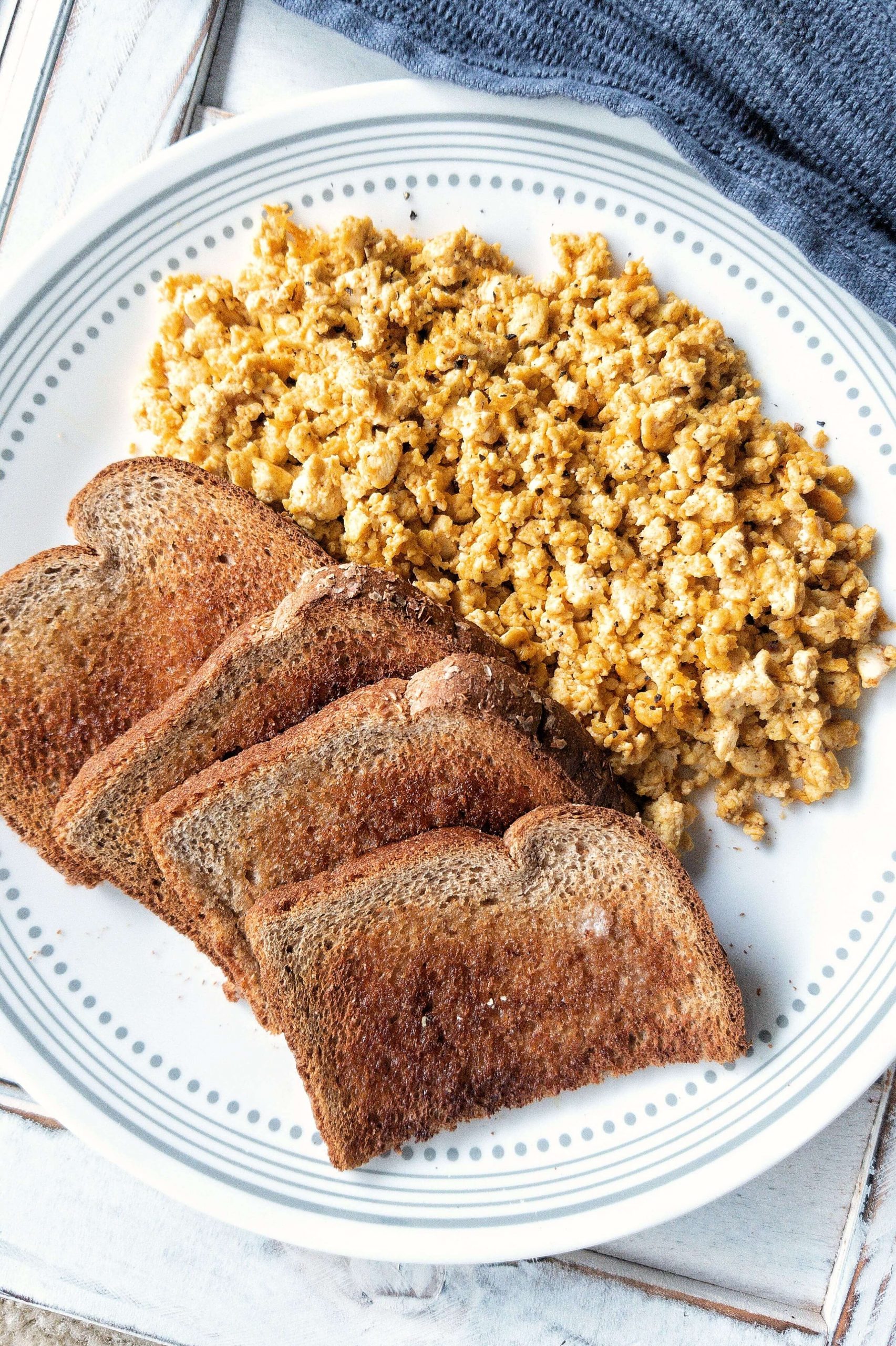 Plate of basic tofu scramble with a side of 4 pieces of toast 