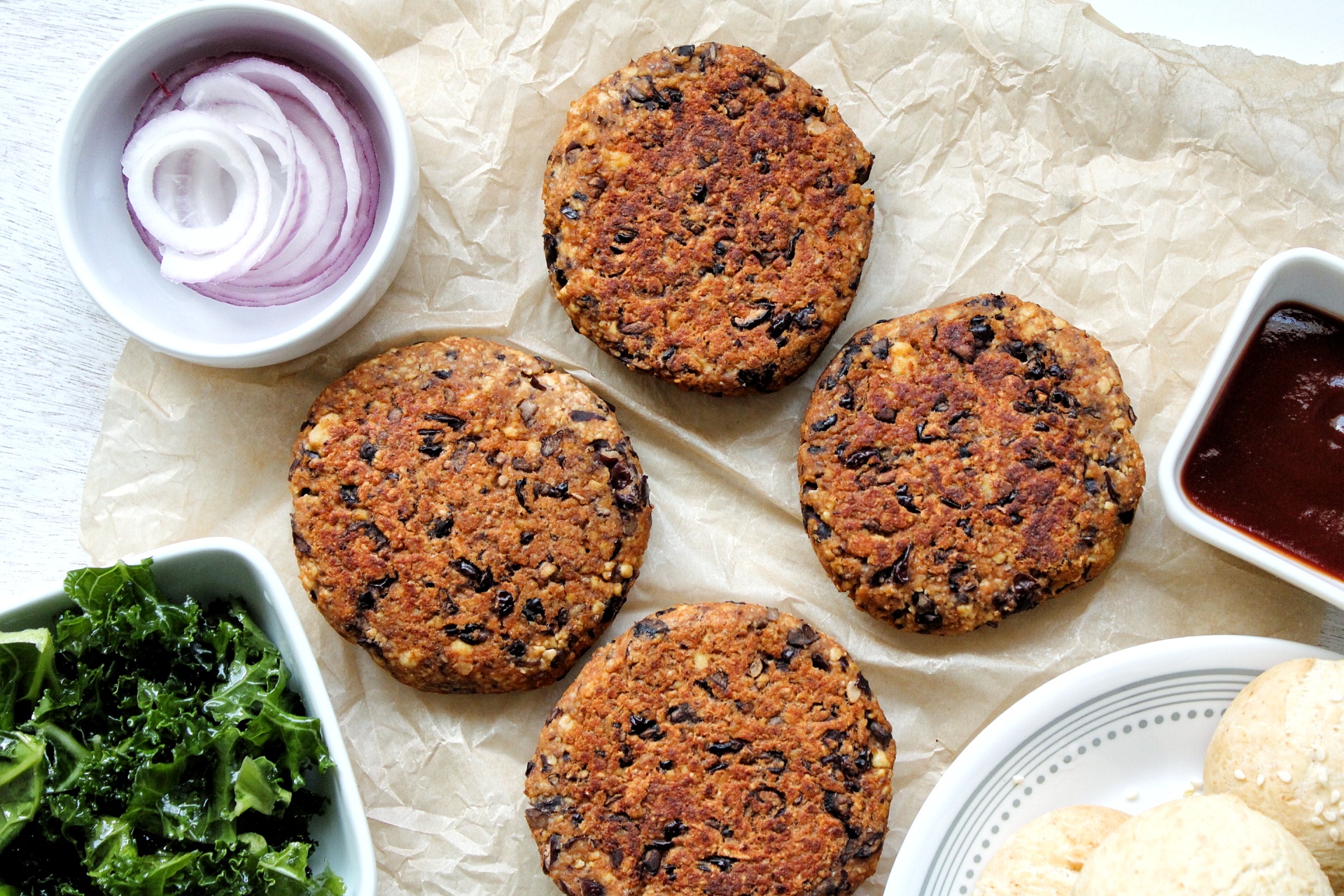 Vegan burger made with tofu, black beans, and mushrooms with toppings