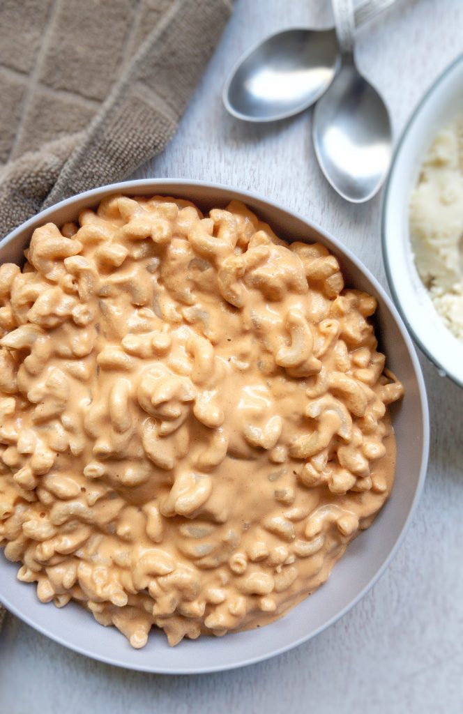 Creamy, smoky, vegan mac and cheese in a gray bowl