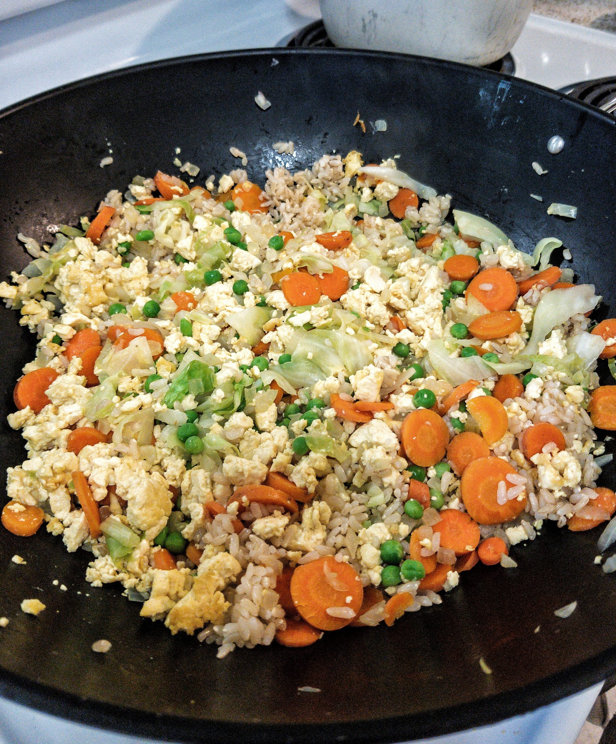 Oil-free, vegan fried rice in a non-stick wok