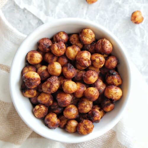 Air fryer chickpeas with cinnamon and brown sugar in a small, white serving bowl.