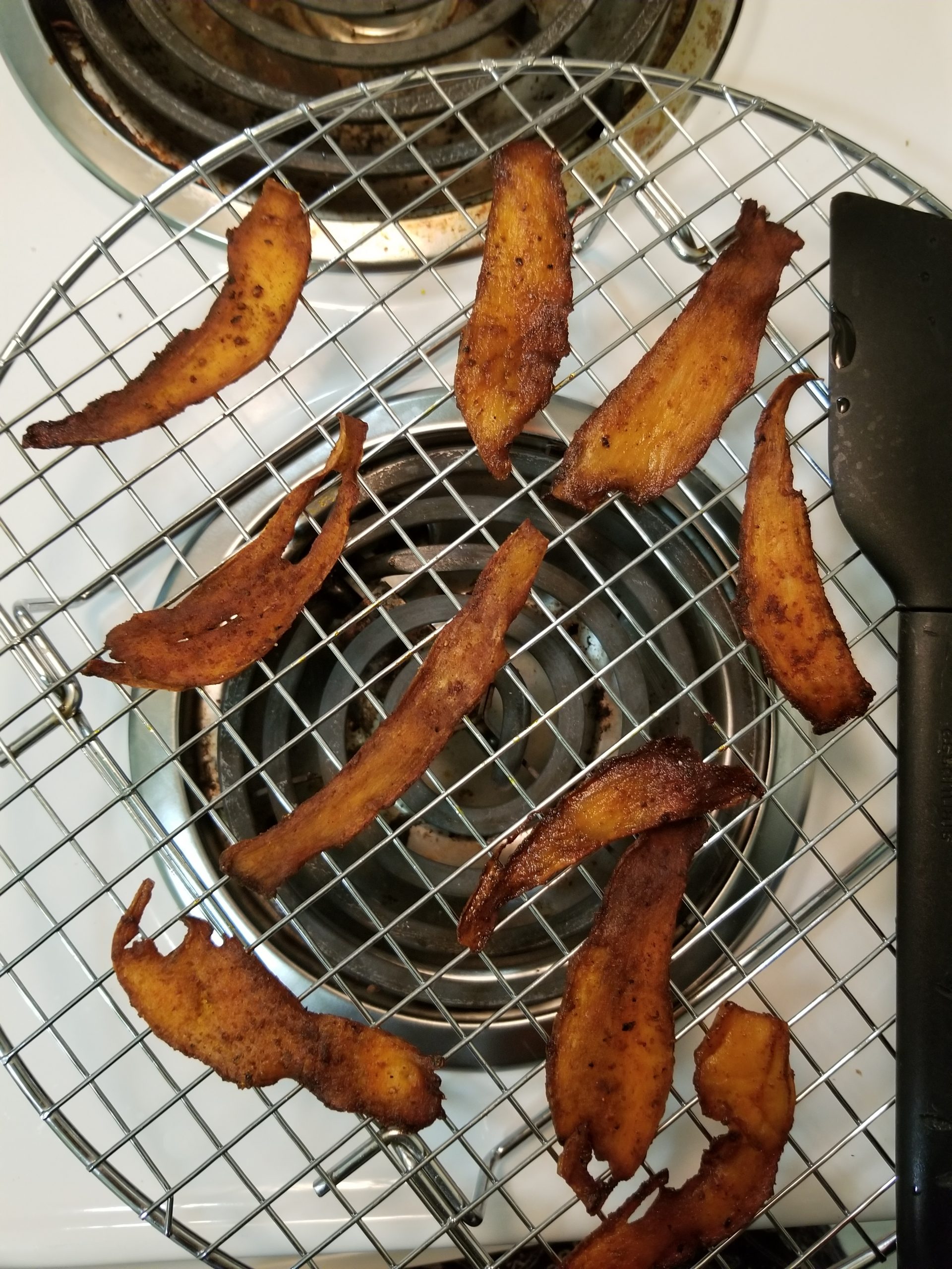 Cooked mushroom bacon cooling on a cooling tray 