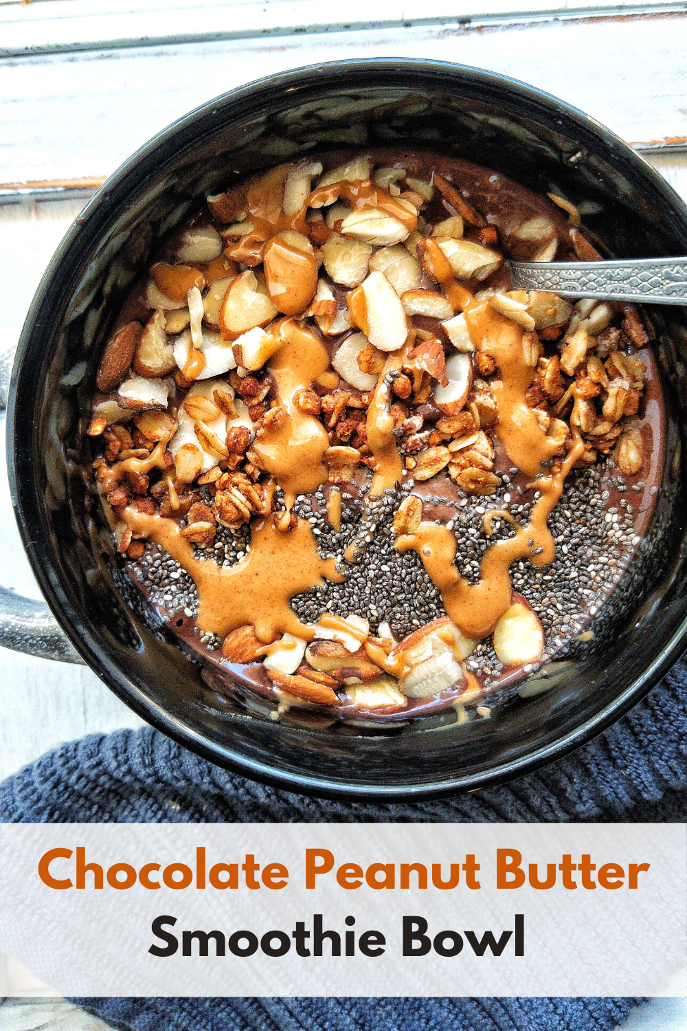 Pinnable image for Pinterest with a bowl of chocolate peanut butter smoothie bowl topped with chia seeds, almonds, a drizzle of peanut butter and granola. 