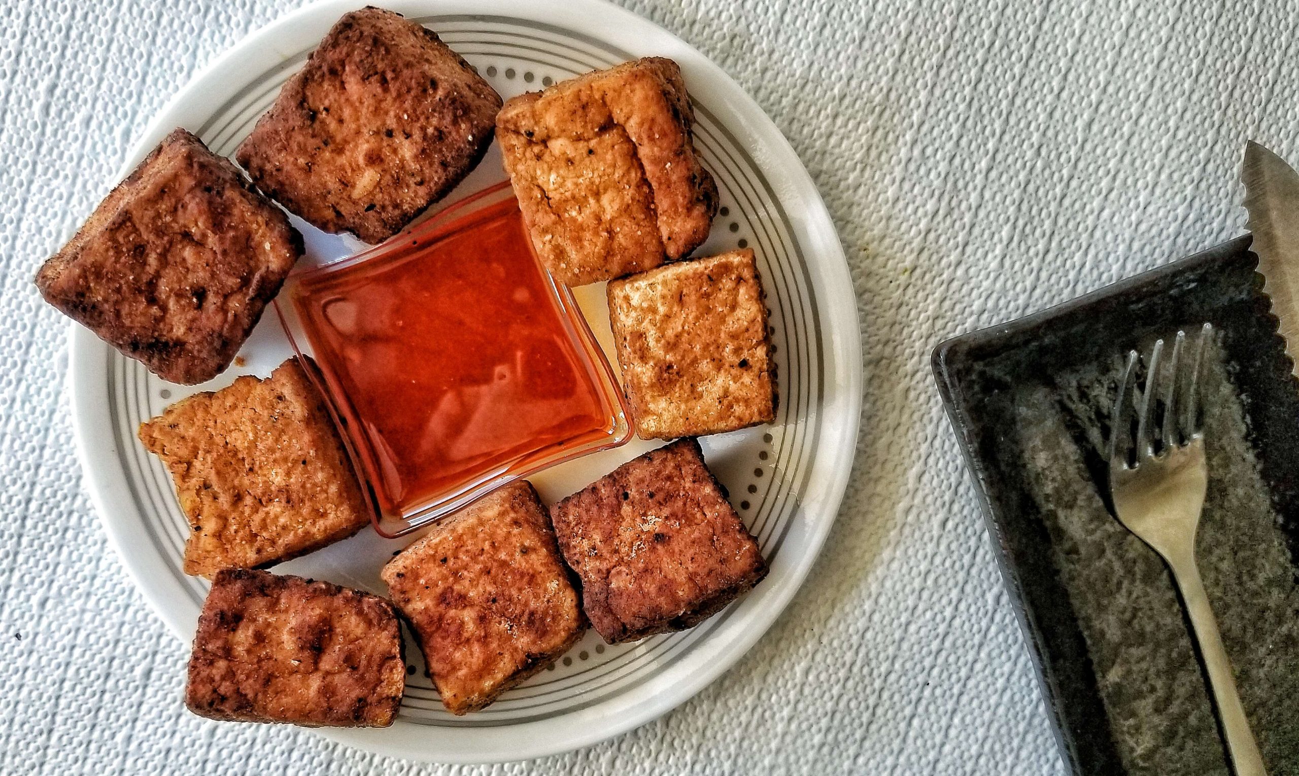 Large square-shaped tofu chunks with a red sauce