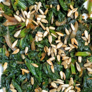 Pan-cooked curly mustard greens with lightly salted roasted sunflower seeds.