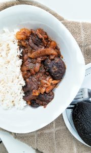 Plant-based stewed mushrooms and onions with Puerto Rican flavors and spices. With a side of white rice