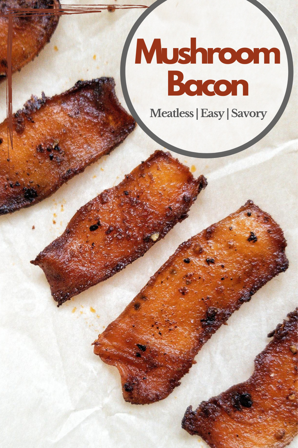 Golden king oyster mushroom bacon on parchment paper. Pinnable for Pinterest.