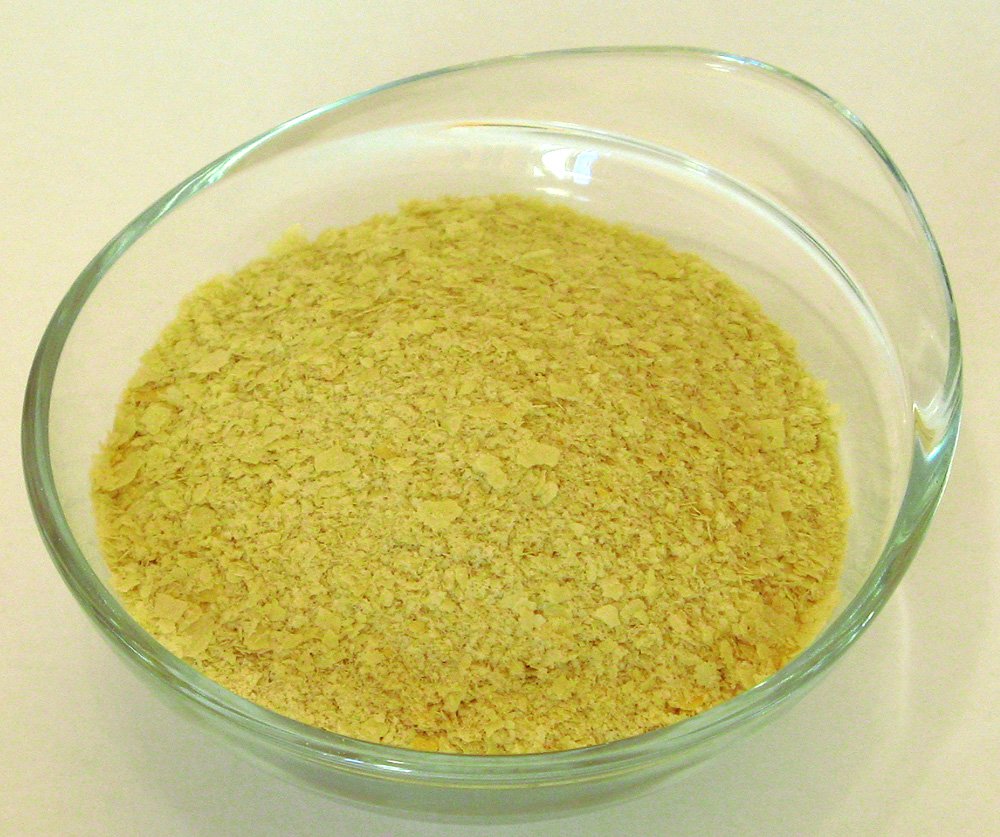 Nutritioonal yeast in a clear bowl