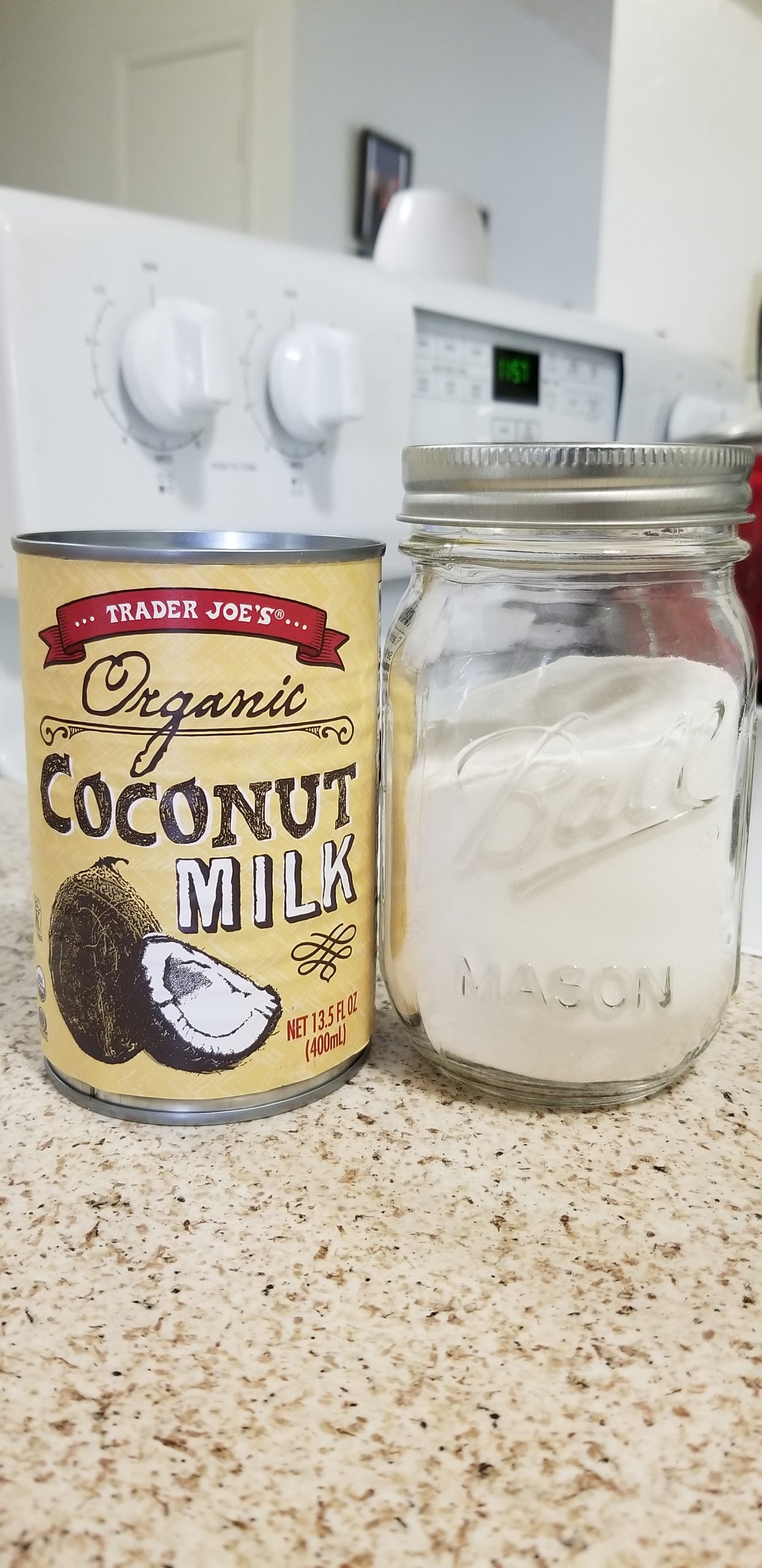 TraderJoe's organic, canned coconut milk with a mason jar of white sugar. 