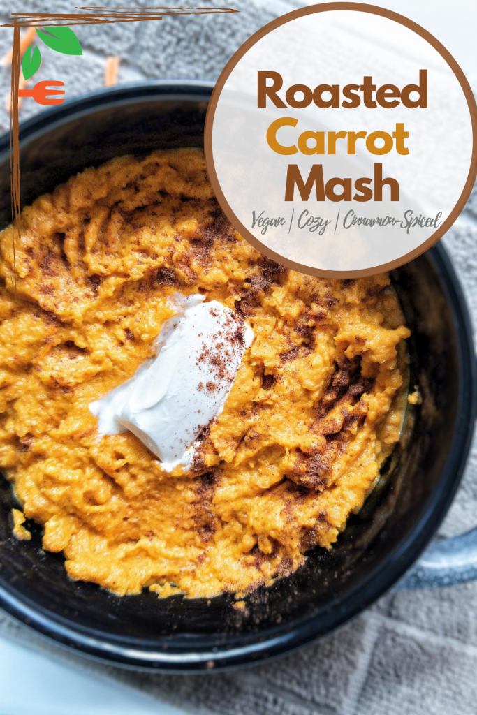 Roasted carrot mash in a black bowl topped with cinnamon and butter. Pinnable for Pinterest