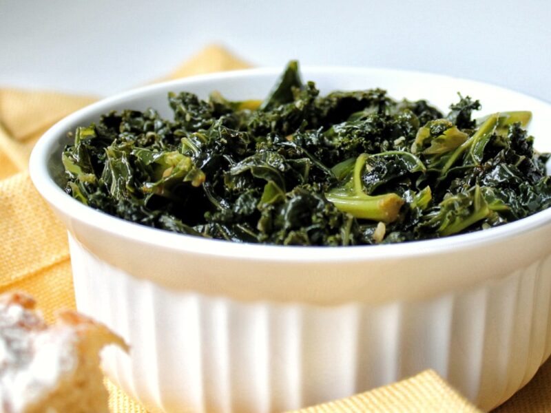 Braised kale in a white bowl