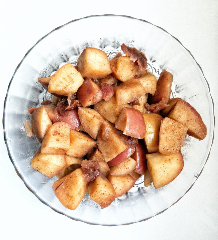 Simmered apples with dates and cinnamon in a bowl