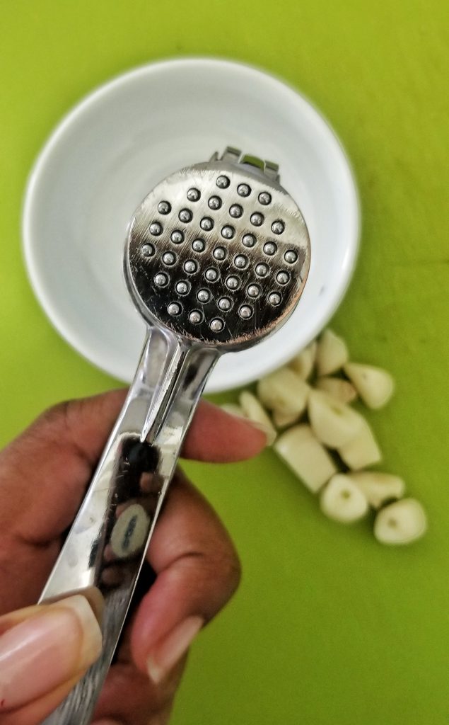 Close-up view of garlic crusher/presser
