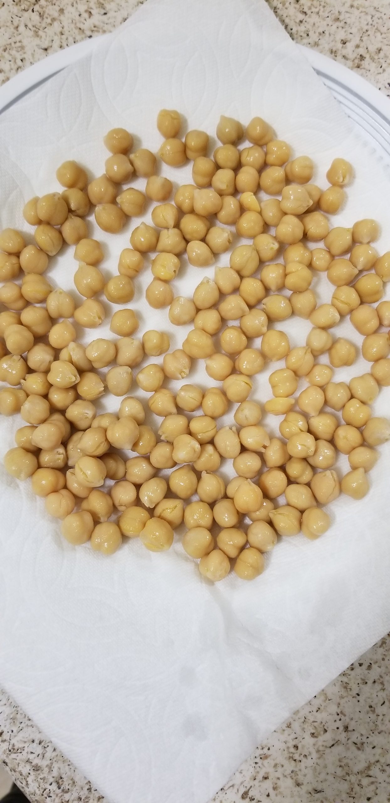 Chickpeas on a plate lined with paper towel