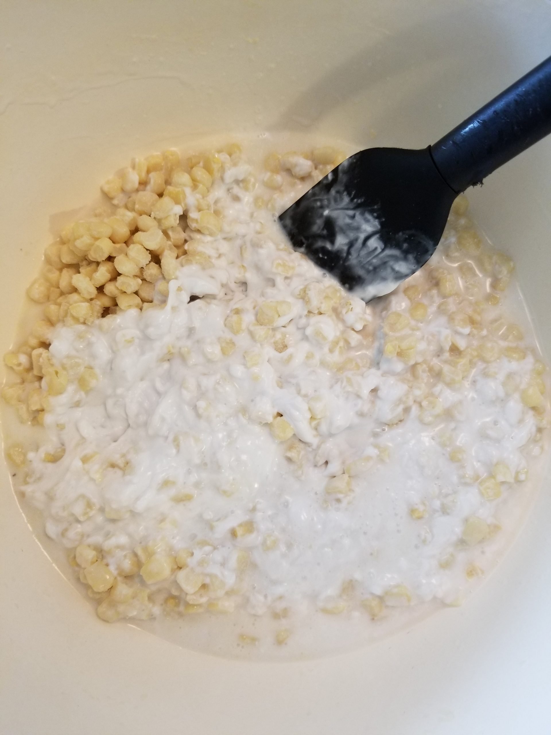 Dutch oven with frozen corn and coconut milk 