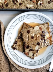 Pancake squares from gluten-free oven sheet pancakes topped with sliced almonds and vegan chocolate chips