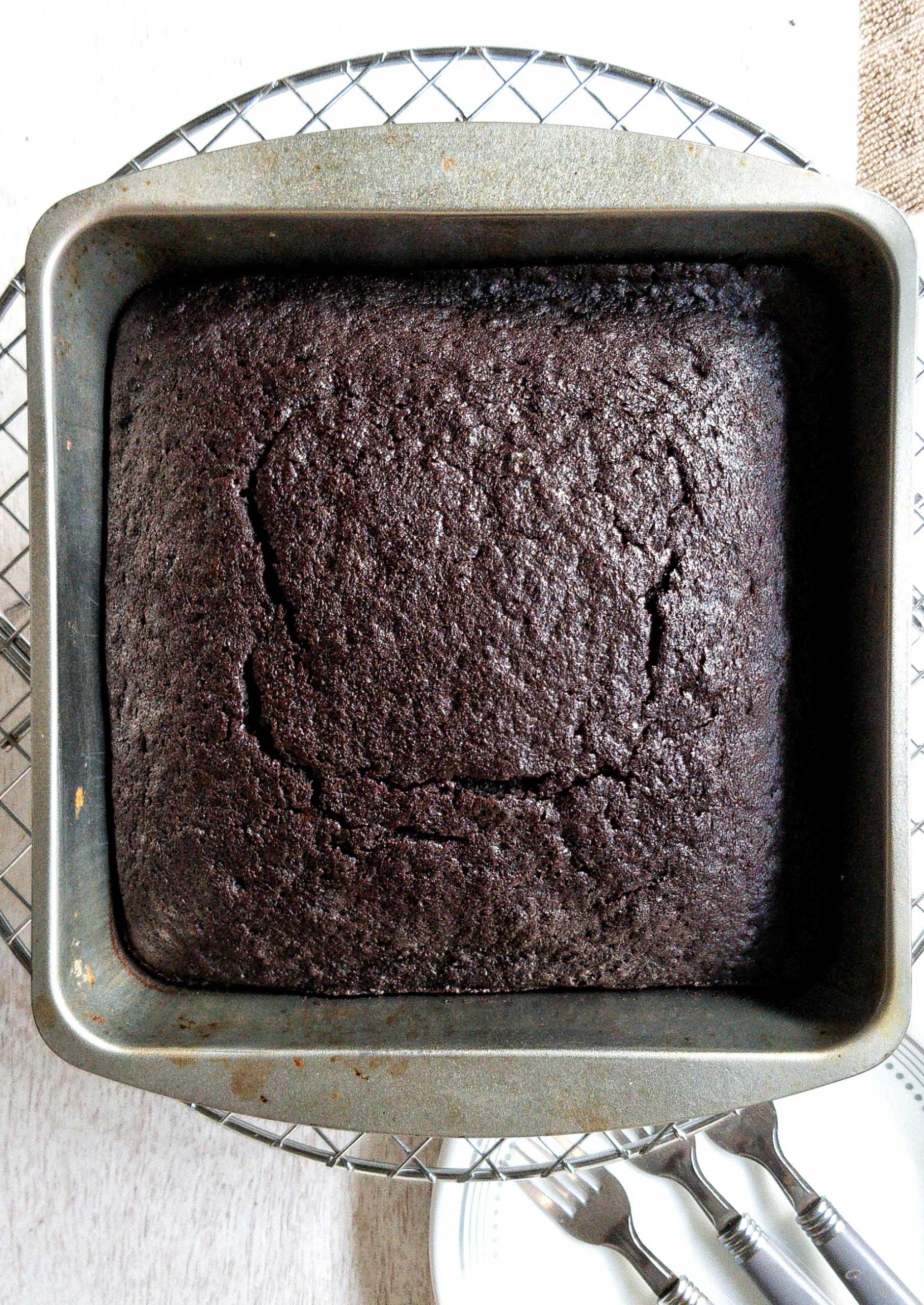 Chocolate devils food cake in a baking pan without a glaze