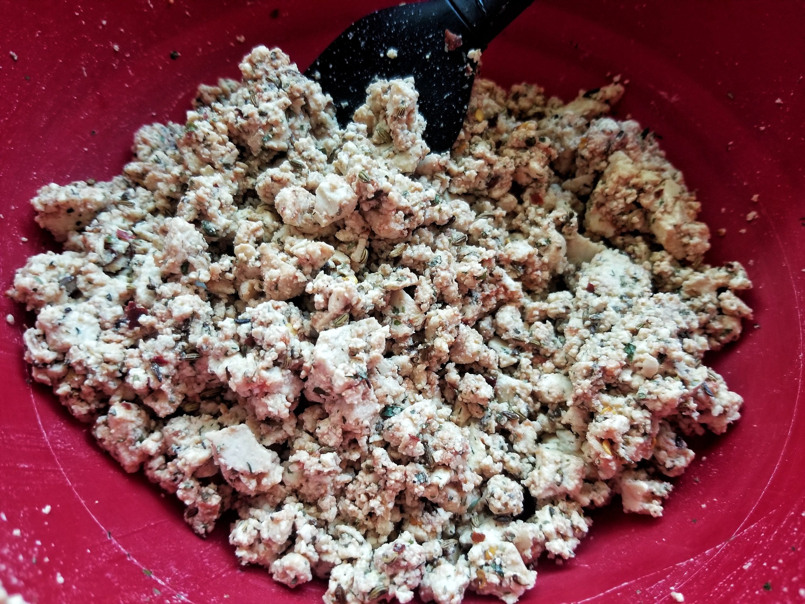 Crumble tofu in a large mixing bowl