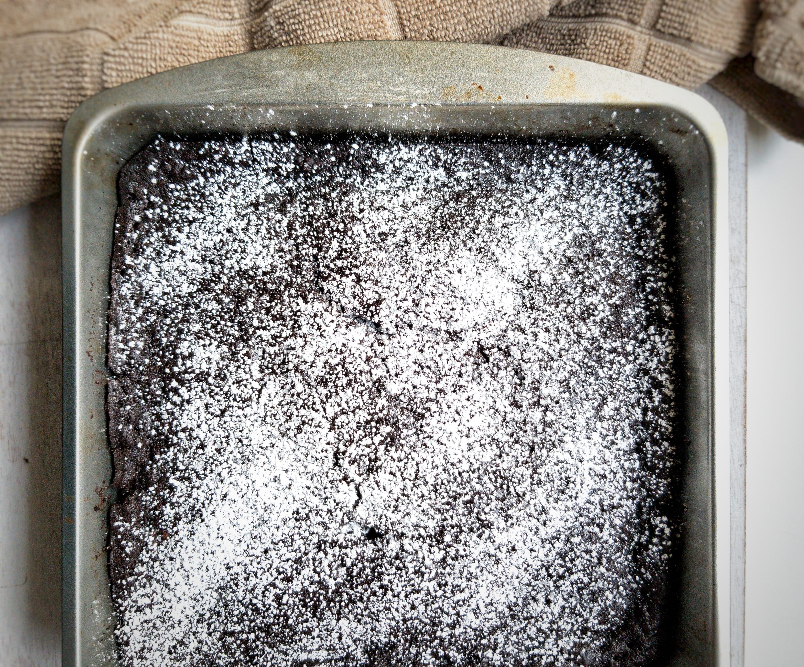 Vegan chocolate devil's food cake with powdered sugar. 