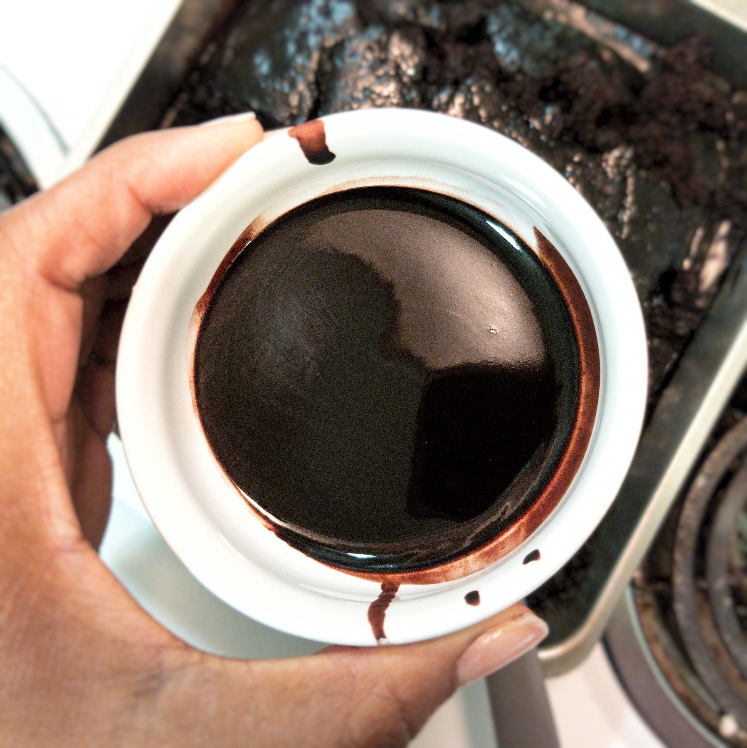 Chocolate sauce in a small white dish, closeup