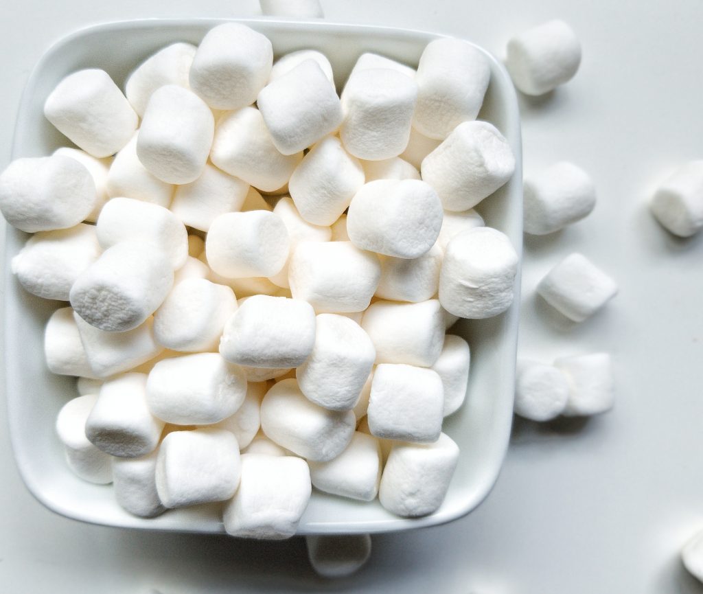 Close-up of marshmallows in a white serving dish