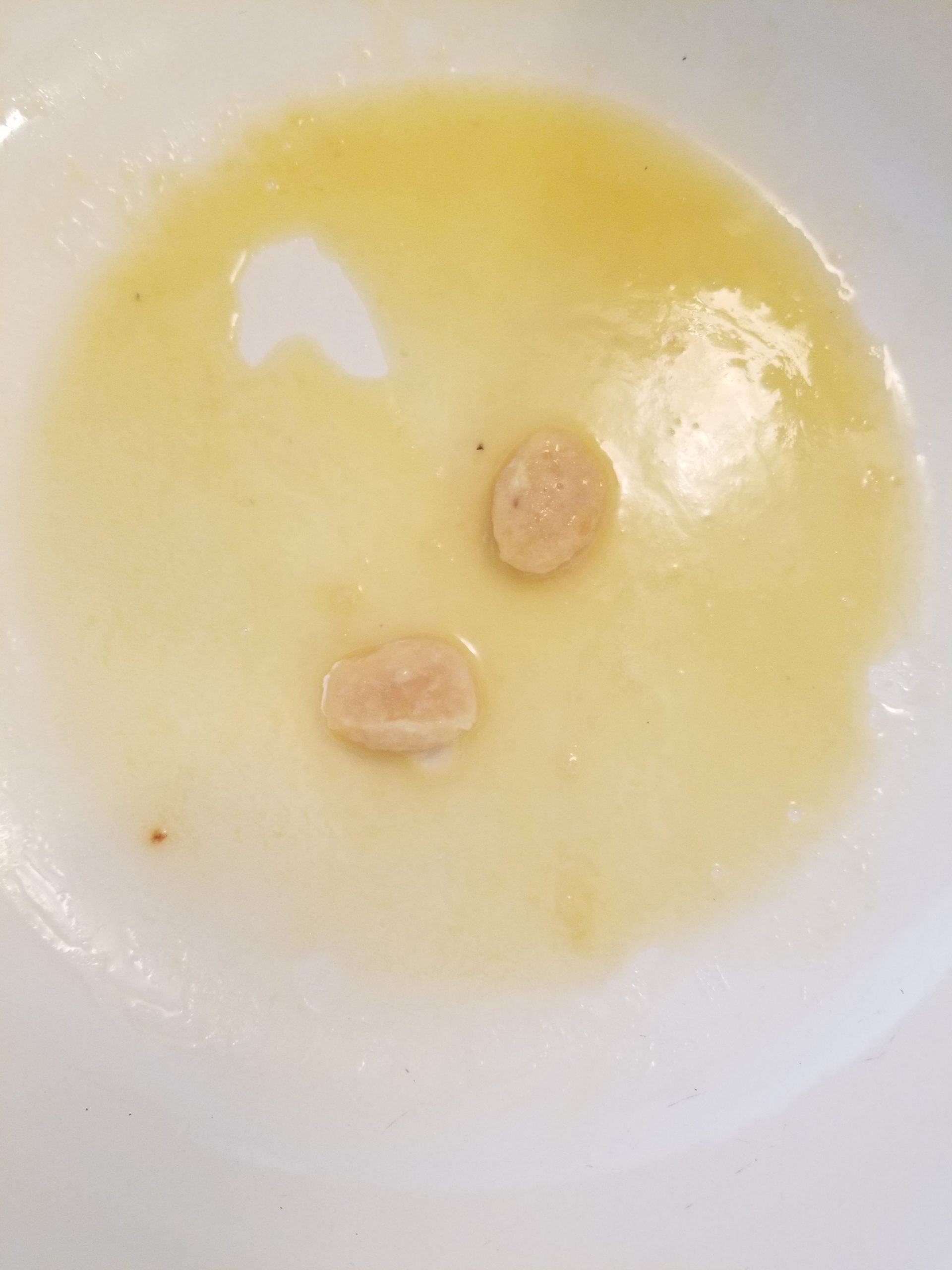 Frozen crushed garlic in melted vegan butter