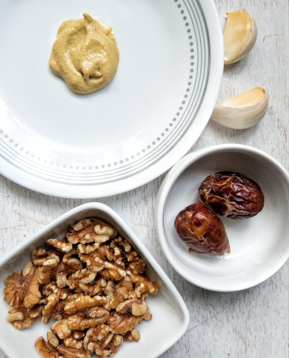 Ingredients for salad dressing: mustard, garlic, dates, walnuts