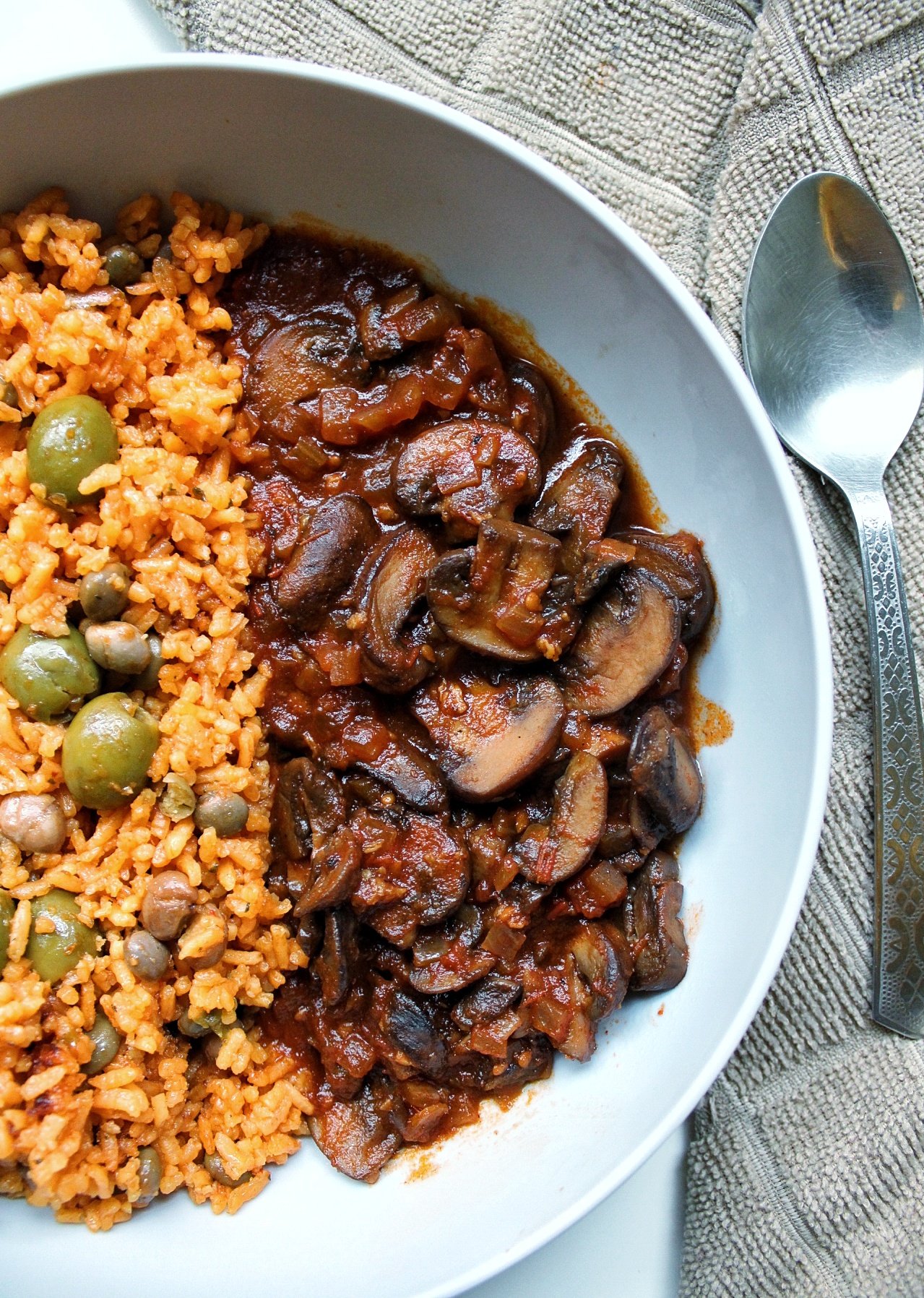 Tomato braised mushrooms with a side of yellow Puerto Rican rice
