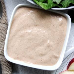 Creamy garlic salad dressing in a small bowl