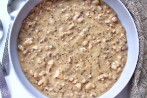 Vegan tofu sauasge gravy in a gray bowl