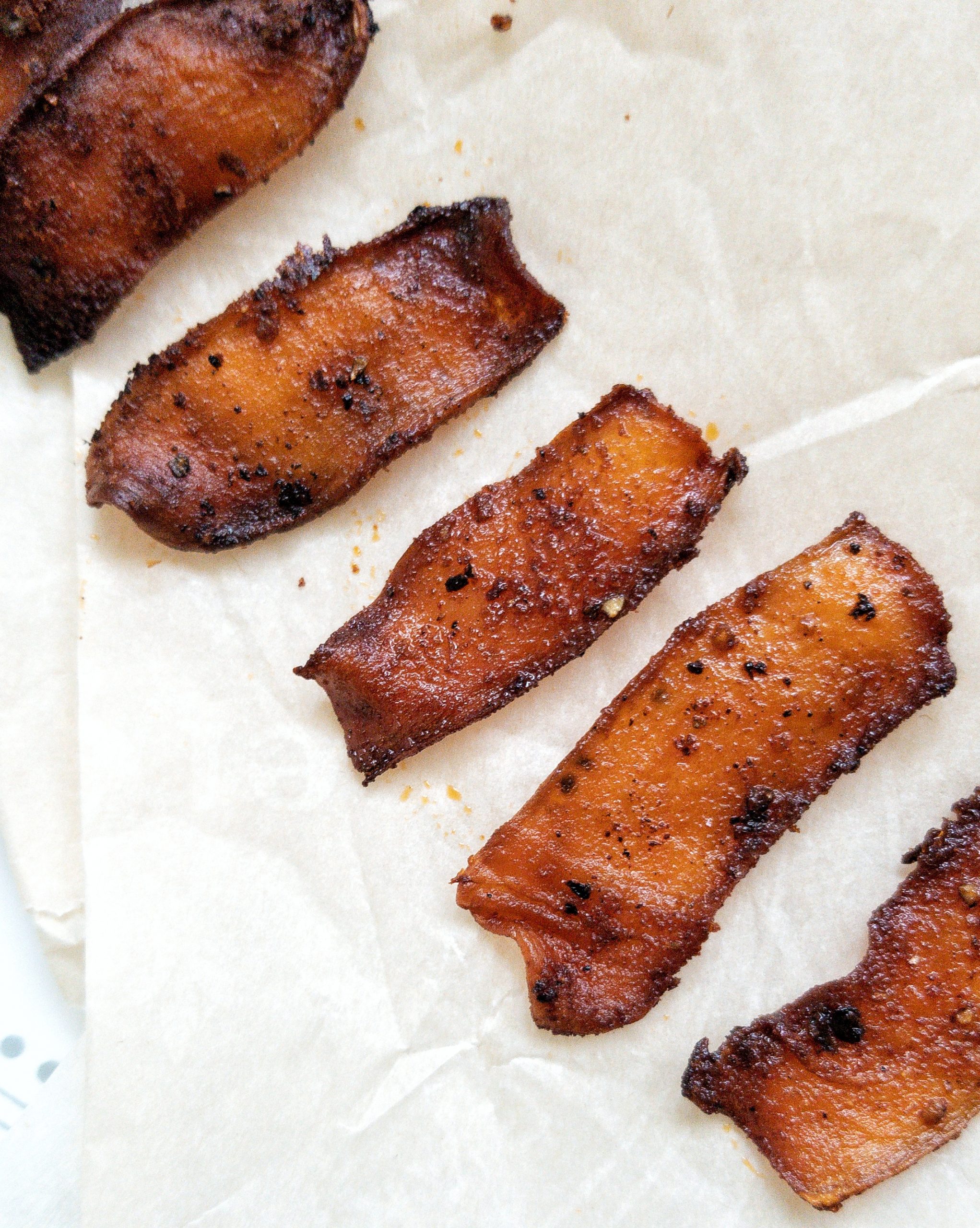 Strips of vegan bacon made from king oyster mushroom