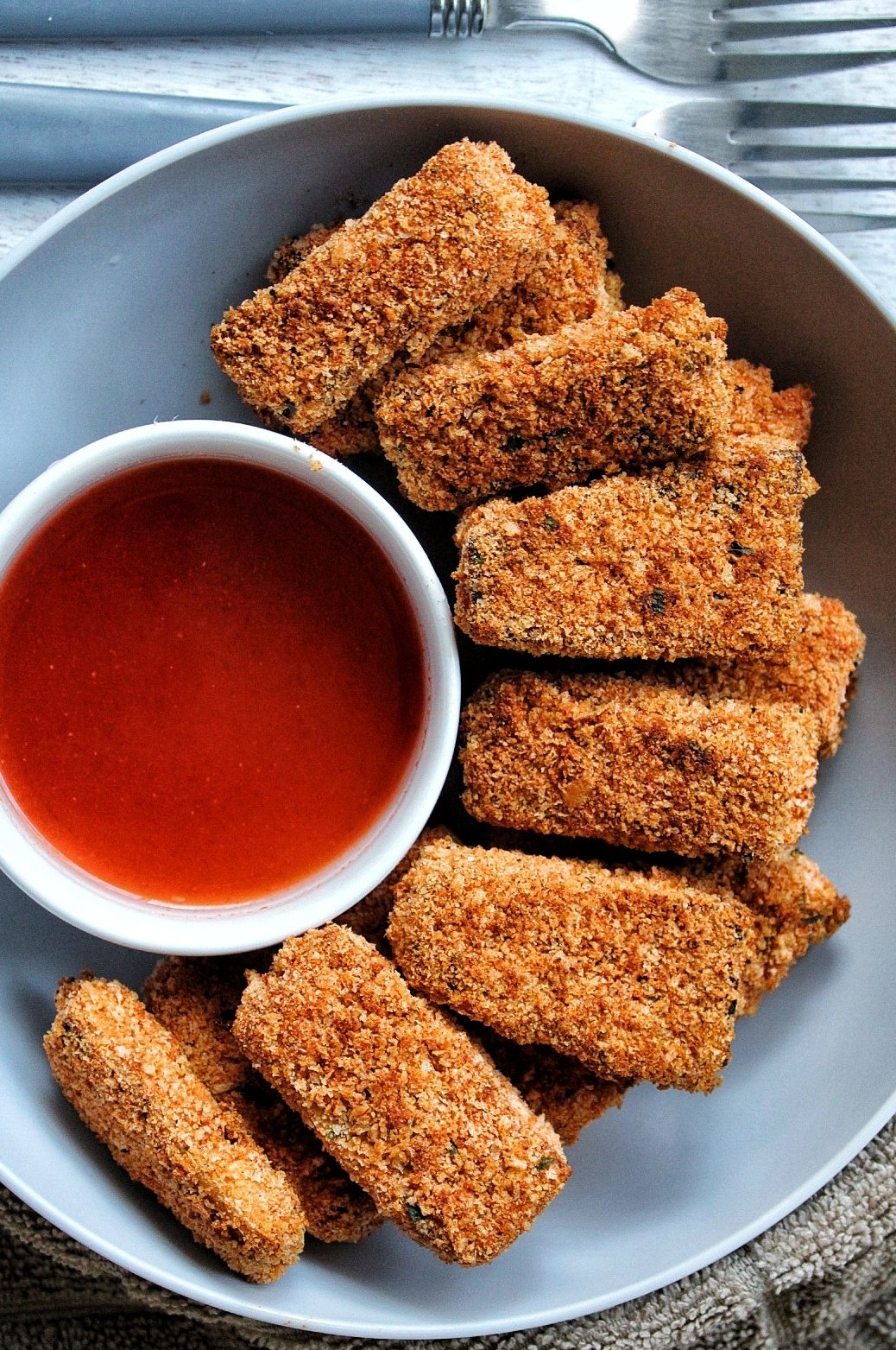 Extra crispy and crunchy tofu nuggets with a homemade honey hot sauce