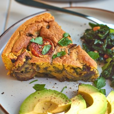 Eggless fritata with a side of sliced avocado