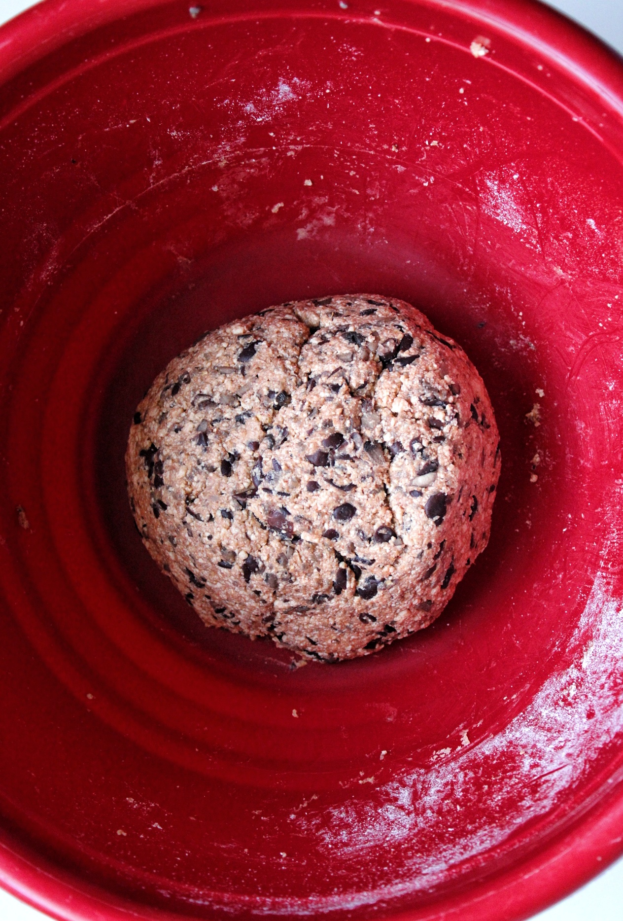 Black bean tofu burger mix shaped into a large ball in a mixing bowl