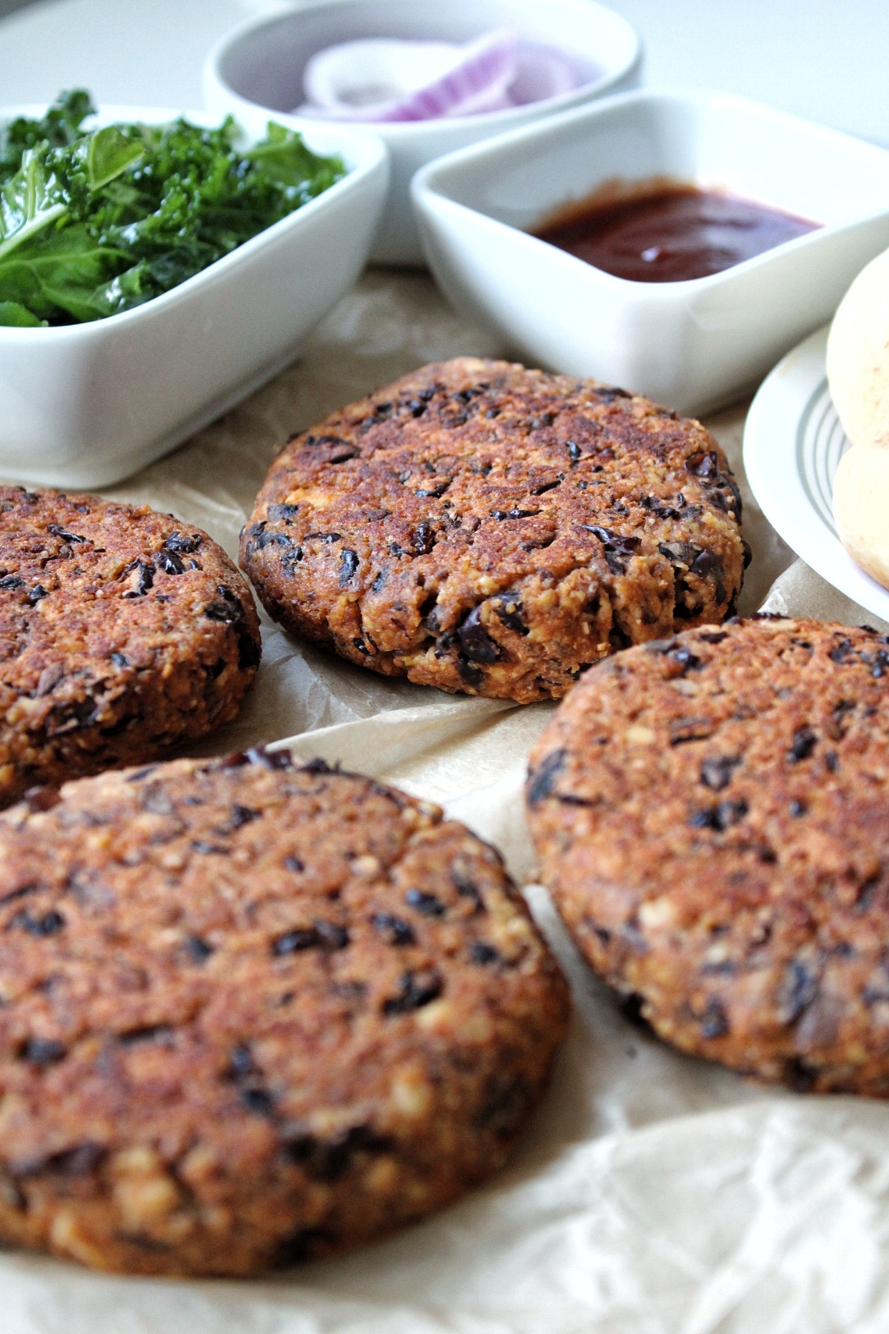 Cooked veggie burger with sides and sauces 