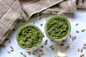 Two 4-ounce canning jars with vegan pesto