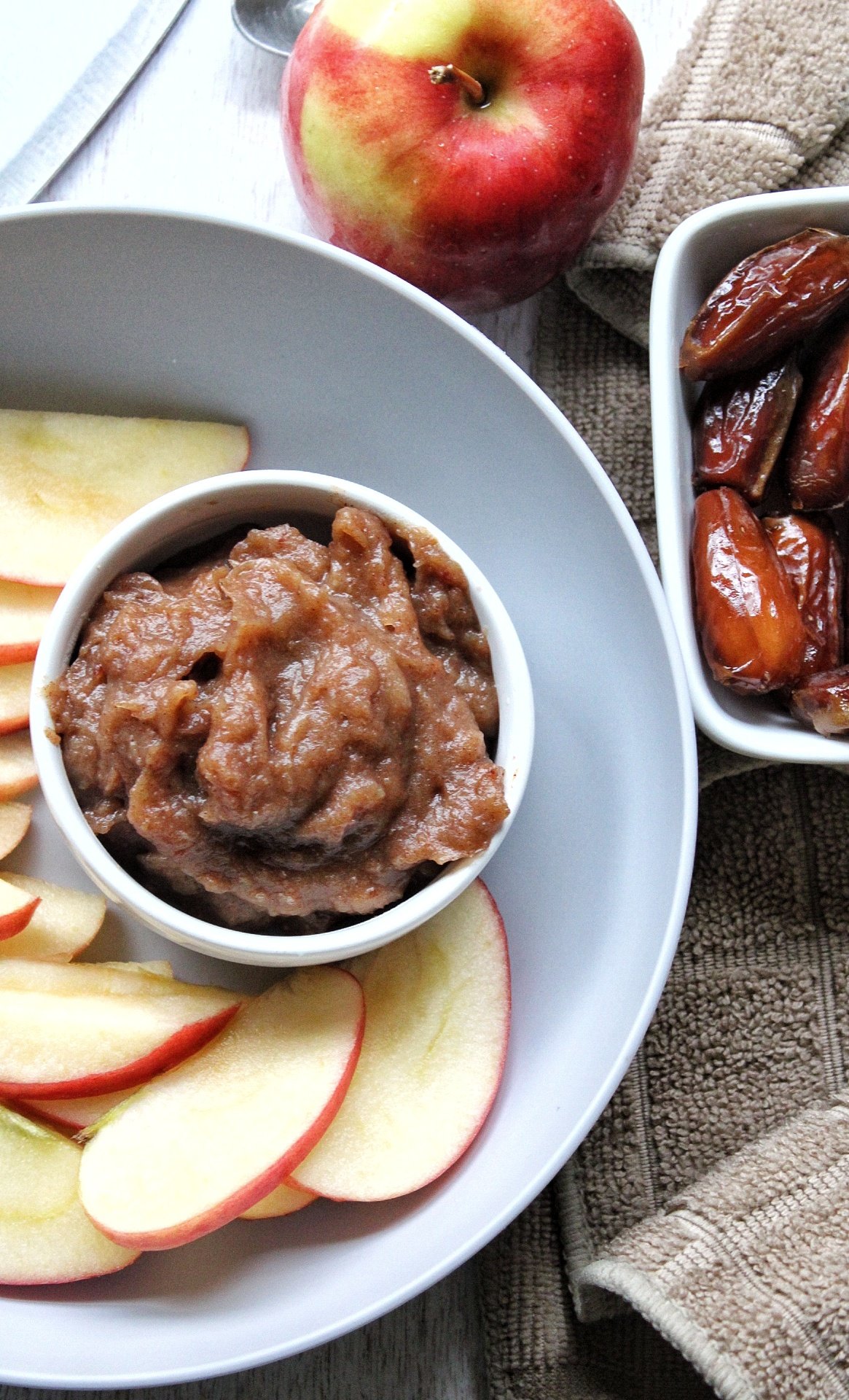 Blended date dip in a small glass dish 