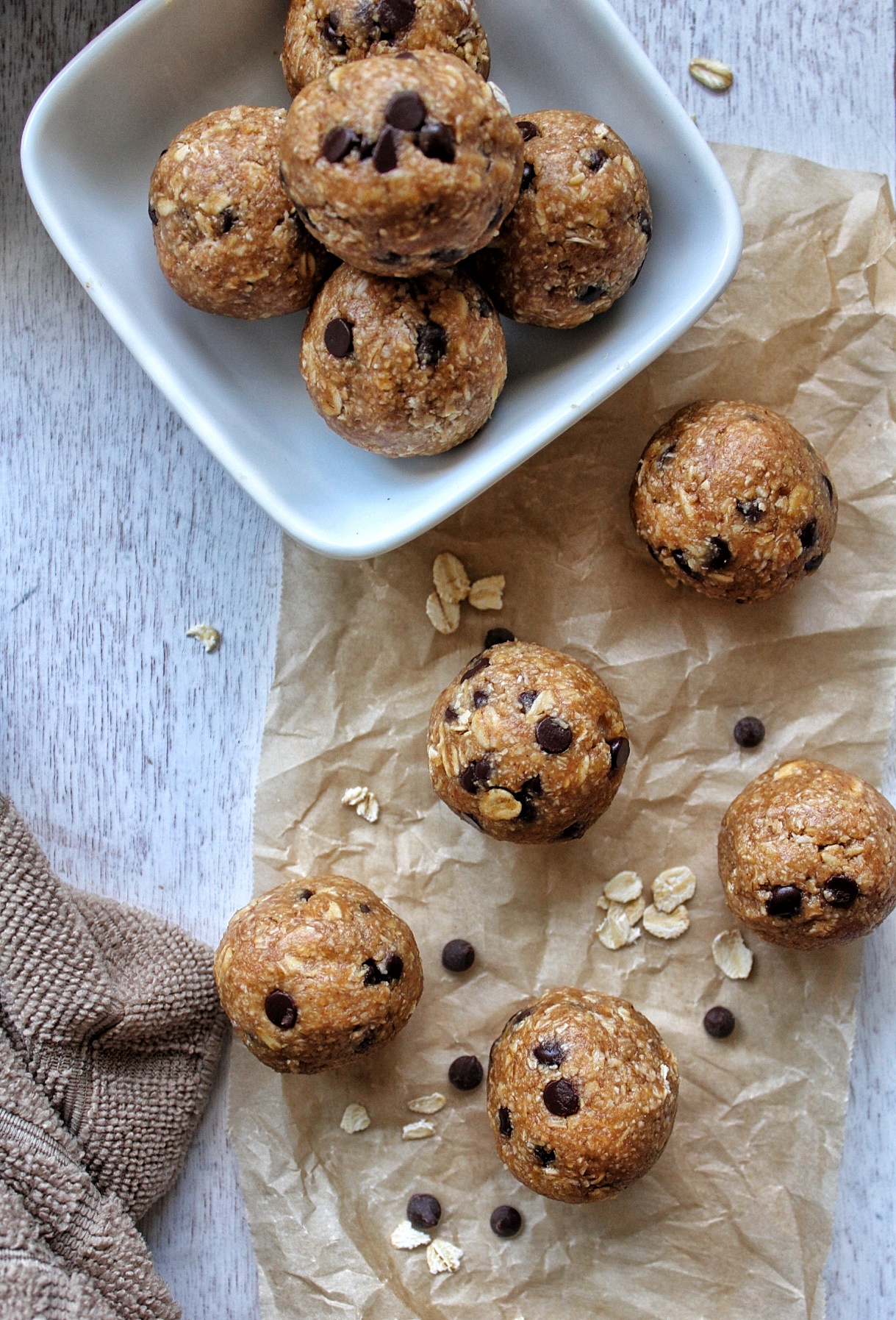 Cookie dough with chocolate chip on parchment paper aind a serving dish