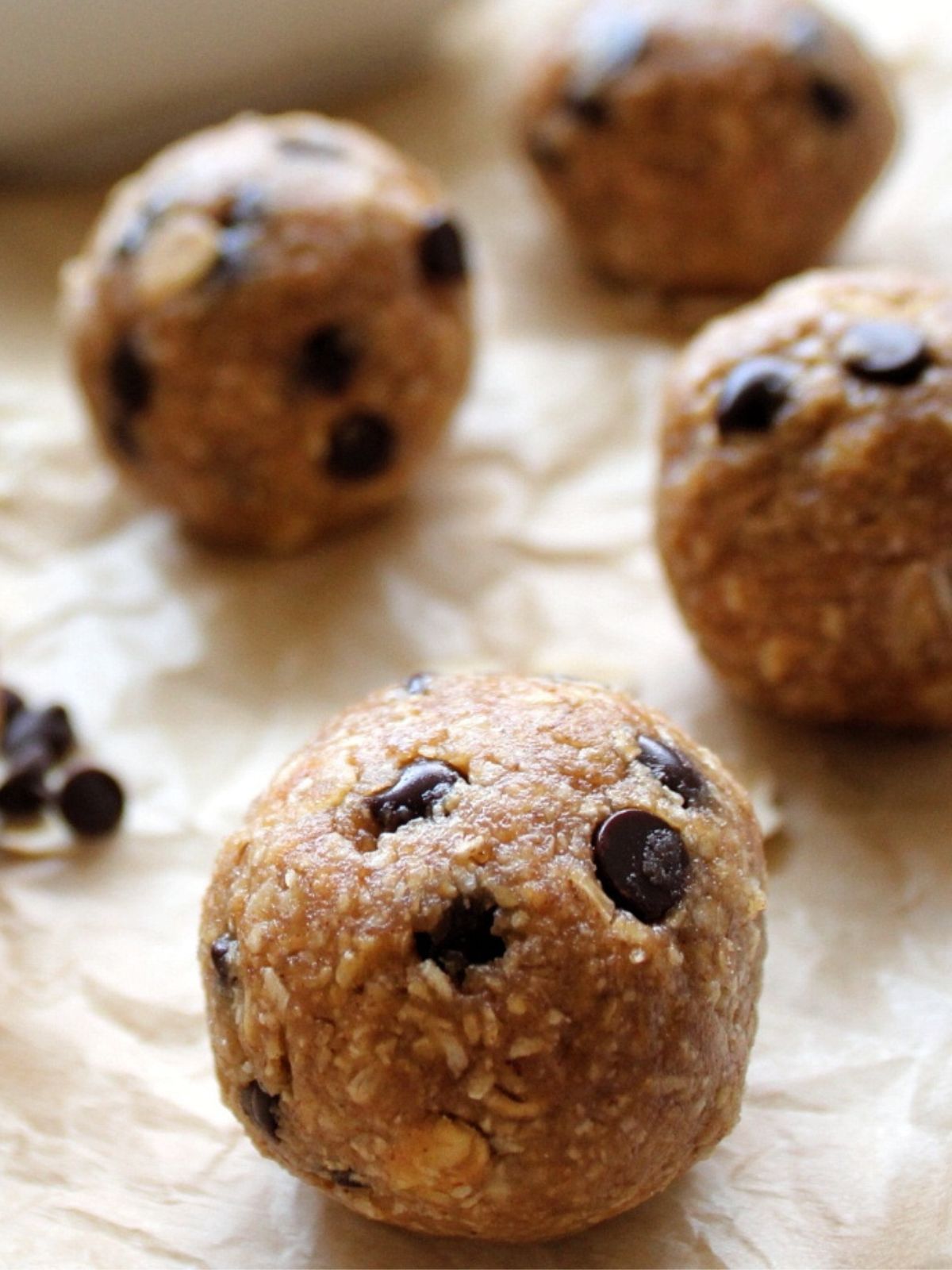 Close-up of edible cookie dough with oats and chocolate chips. 