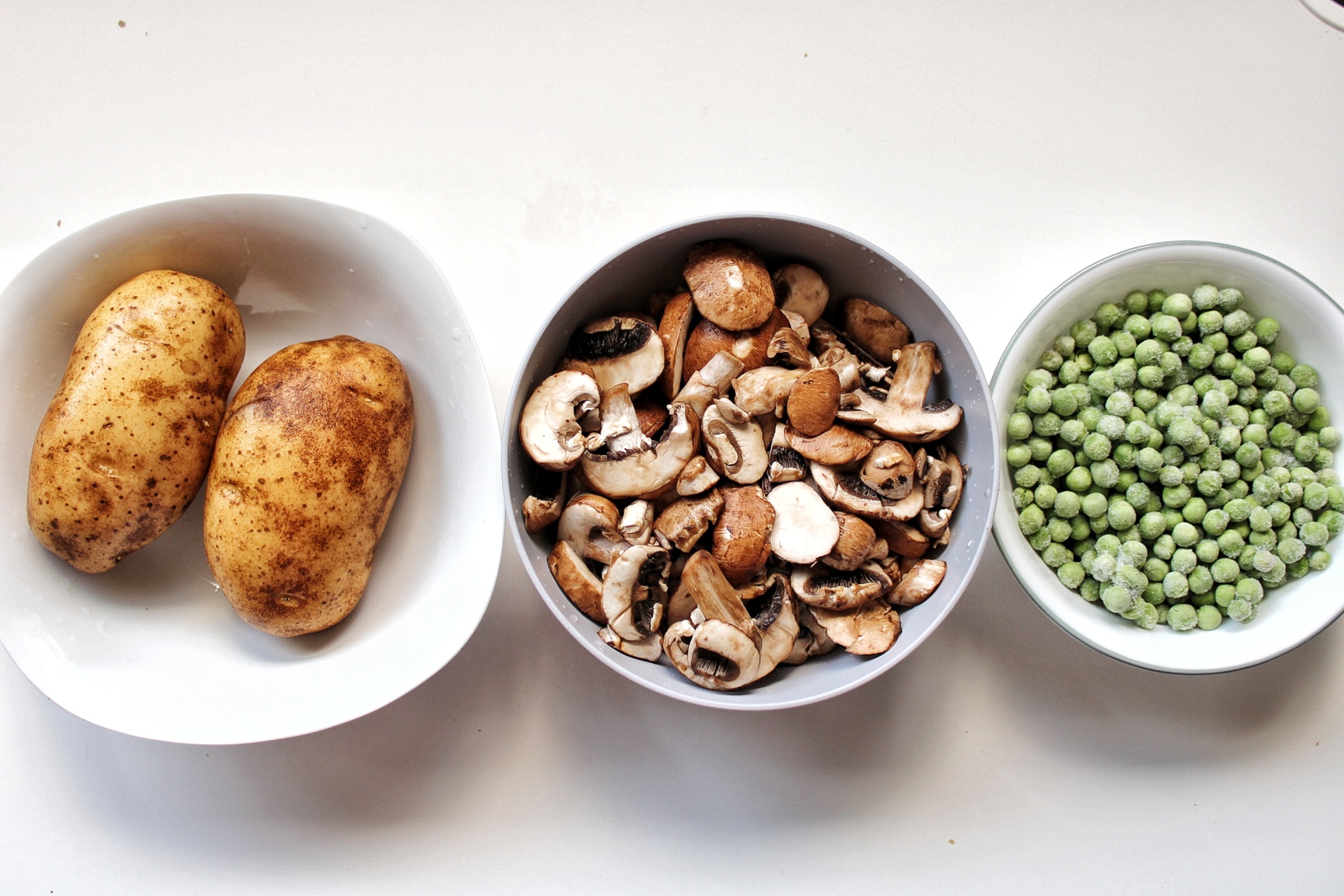 Russet potatoes, sliced mushrooms, and frozen green peas 