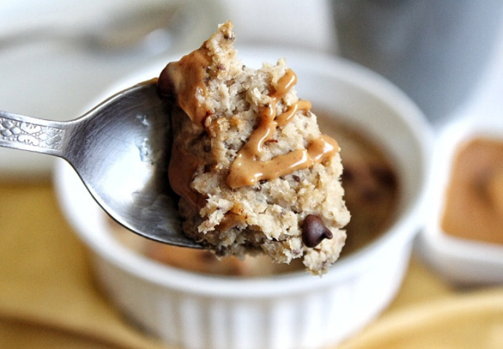 Spoonful of baked oats with a peanut butter drizzle