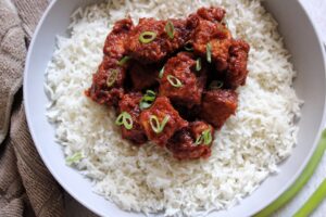 Saucy smoked tempeh cooked in a chiptole sauce and served on a bed of rice