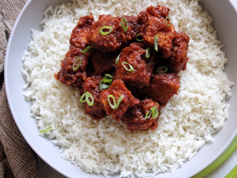 Saucy smoked tempeh cooked in a chiptole sauce and served on a bed of rice