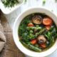 Springtime soup with mushrooms, asparagus, peas, and carrots