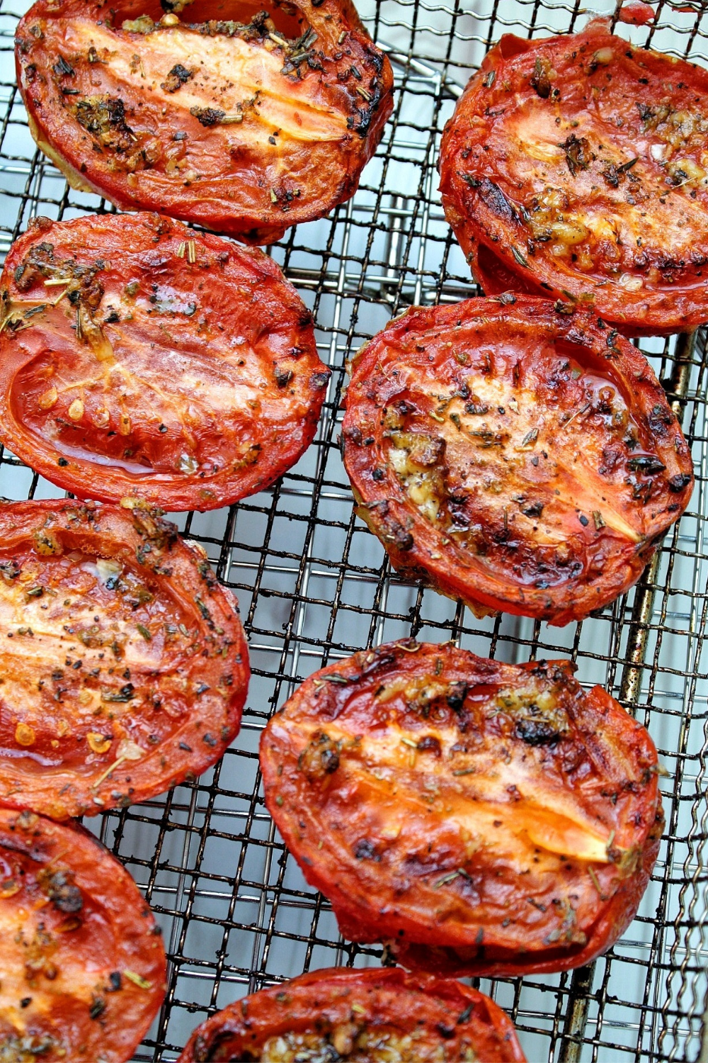 Up close tomato halves roasted with olive oil and Italian herbs