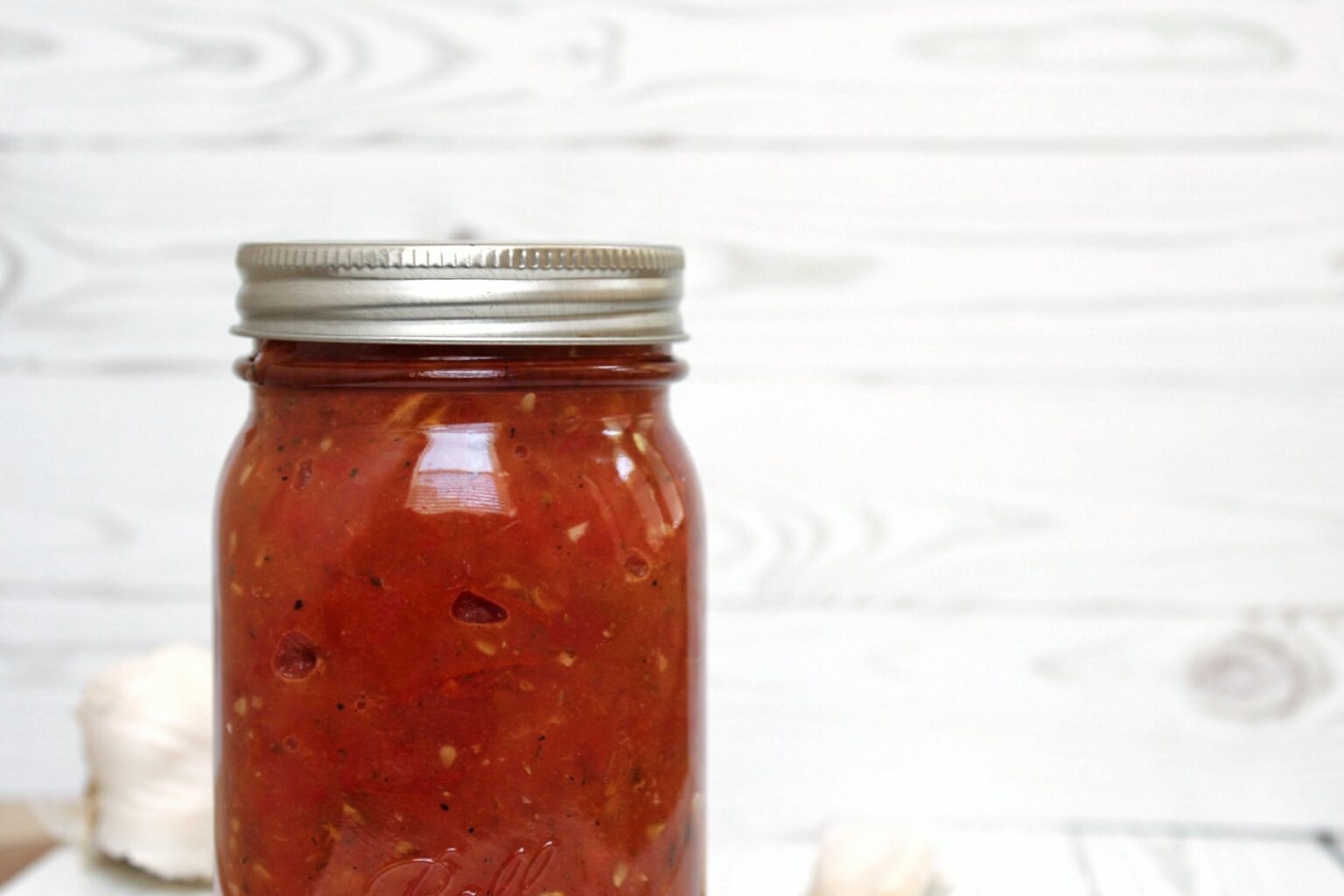 Homemade roasted tomato in a closed mason jar